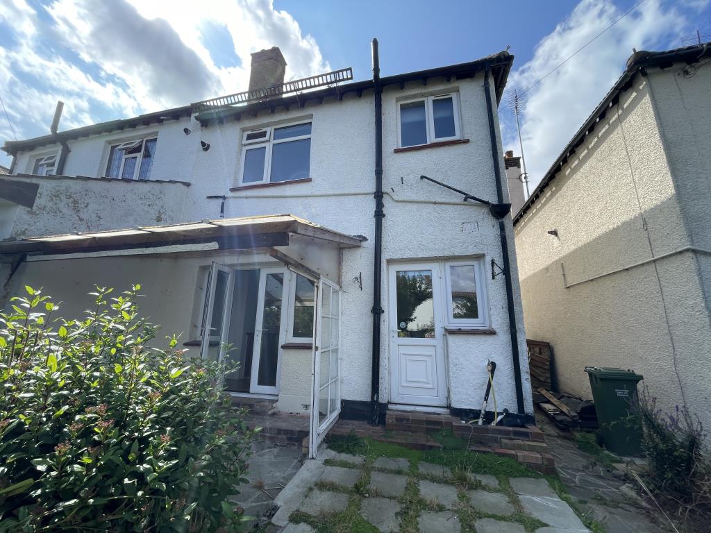 Lot: 103 - THREE-BEDROOM SEMI-DETACHED HOUSE FOR IMPROVEMENT - outside image of rear of house from garden with side access